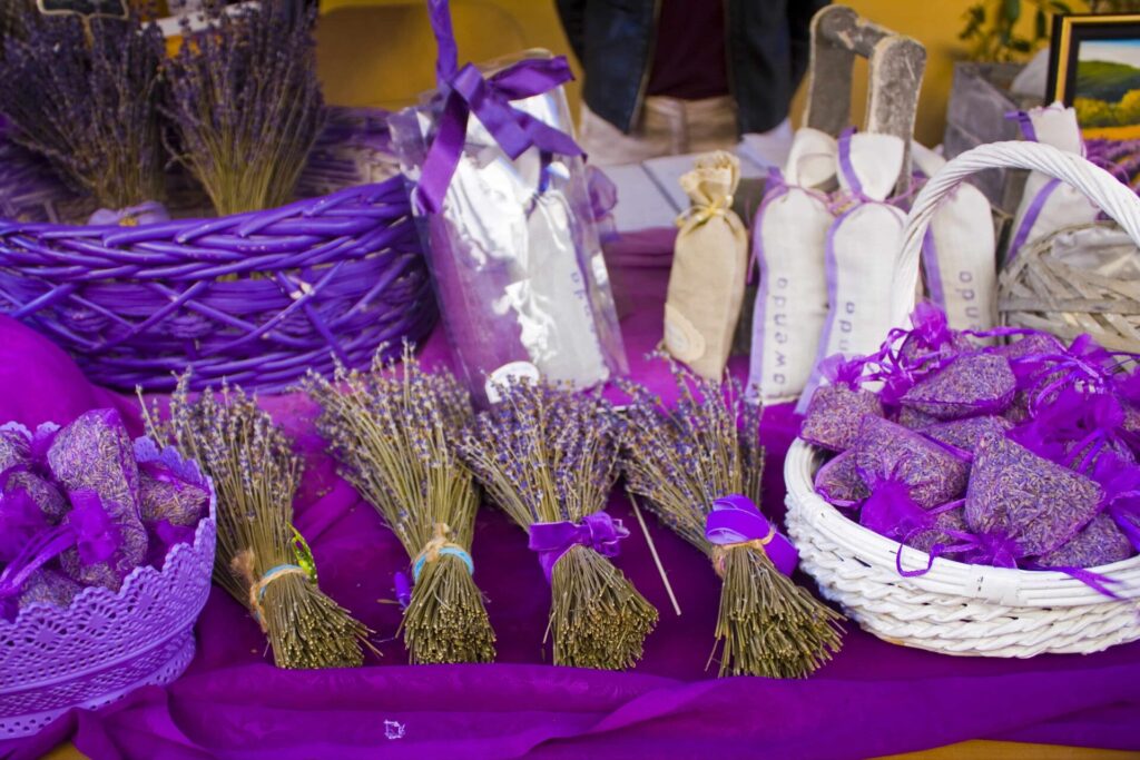 Bundles and sachets of dried lavender from Provence, popular souvenirs from France for travelers seeking fragrant keepsakes.