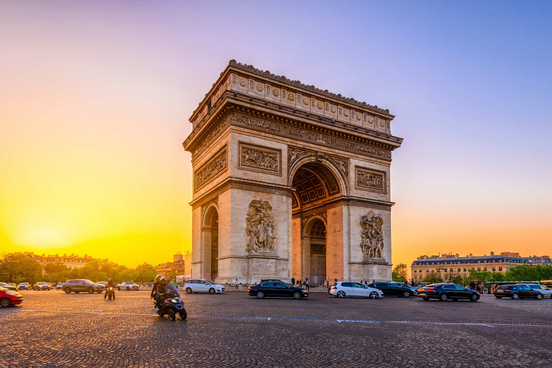 Arc de Triomphe in Paris illuminated by warm sunset light