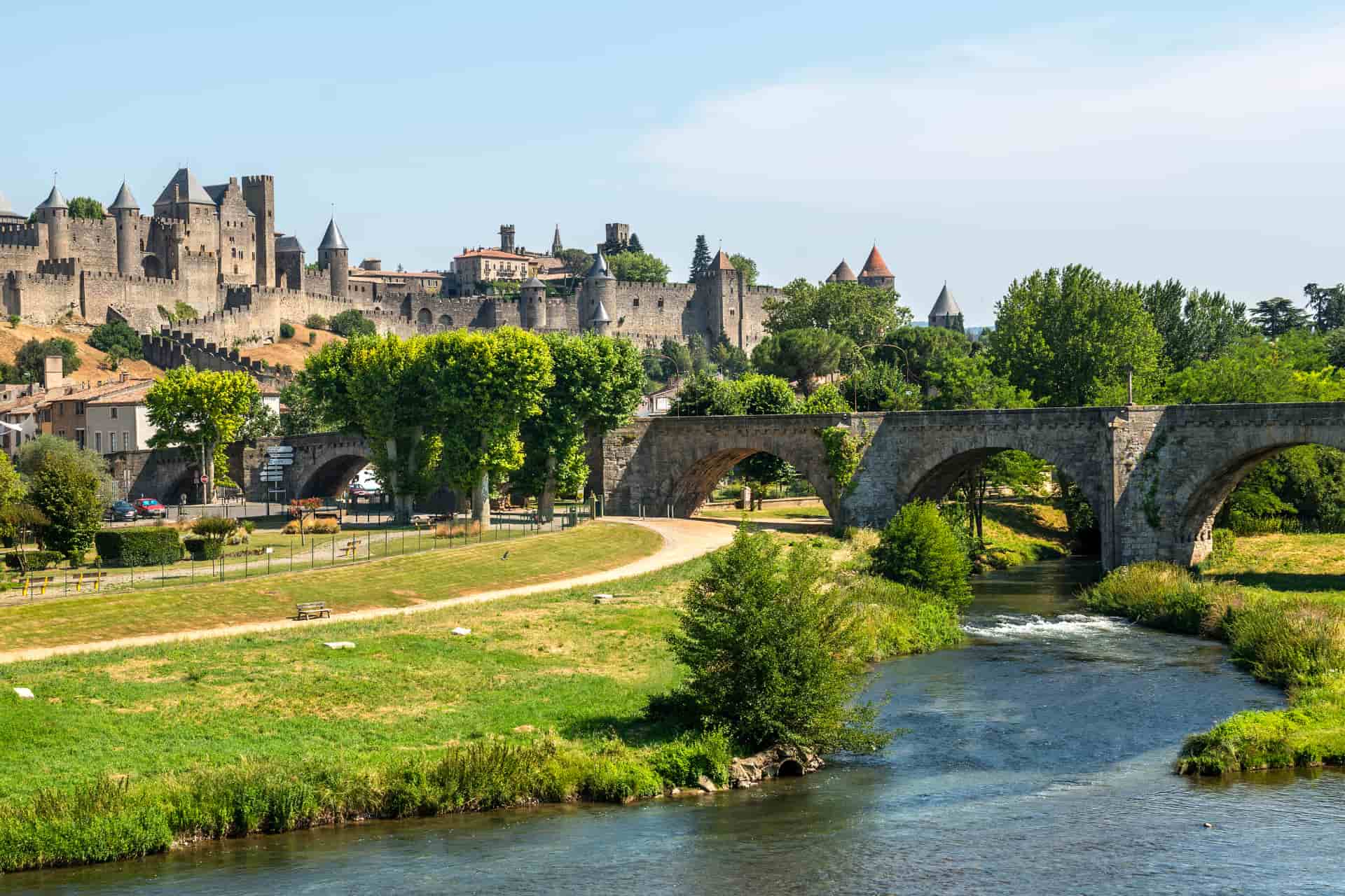 Scenic French town with a historic bridge, river and traditional architecture